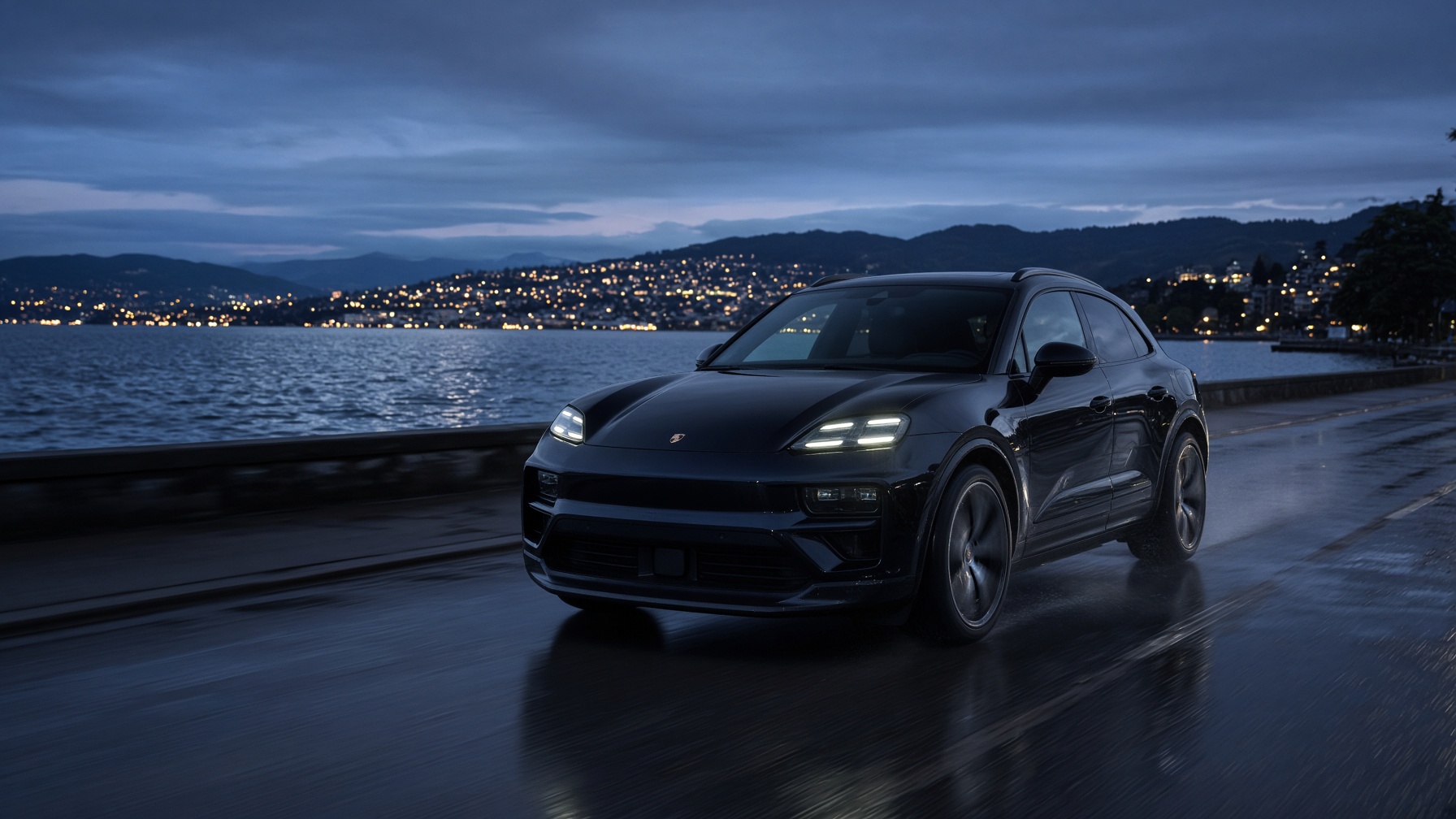 Porsche Macan noir sur la route du Léman, à l'heure bleue